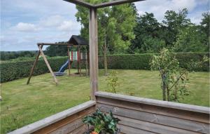 a yard with a playground with a swing at Holiday Home Egernsund 1 in Egernsund
