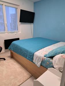 Ένα ή περισσότερα κρεβάτια σε δωμάτιο στο Apparemment T11