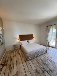 Postel nebo postele na pokoji v ubytování Su Entu Sardinian Country Club + 37 fotografií