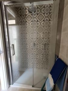 a shower with a glass door in a bathroom at Terry house in Noci +33 photos