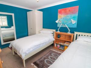 En eller flere senge i et værelse på Turnstone