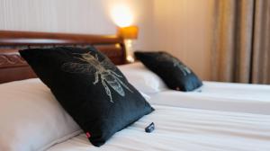 Posteľ alebo postele v izbe v ubytovaní Hotel Sen