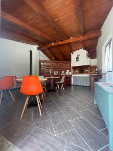 a kitchen with a table and chairs in a room at Casale Conti in Castellabate