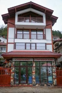 a building with a balcony on top of it at Stanchevata Kashta in Zlatograd