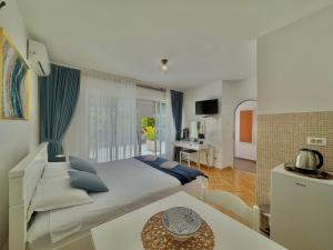 Katil atau katil-katil dalam bilik di FOR-A Apartmani