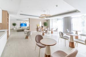 Televiisor ja/või meelelahutuskeskus majutusasutuses GuestReady - Lush Apt overlooking The Palm
