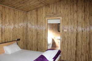 Voodi või voodid majutusasutuse The Sylvan Hut toas