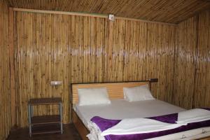 Voodi või voodid majutusasutuse The Sylvan Hut toas