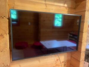 Uma cama ou camas num quarto em モリソンヴィラ 石垣のログハウス