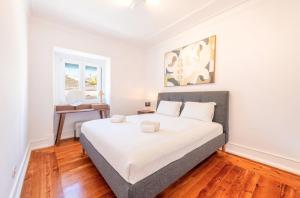 Ένα ή περισσότερα κρεβάτια σε δωμάτιο στο GuestReady - Vibrant Soul in the Heart of Belem