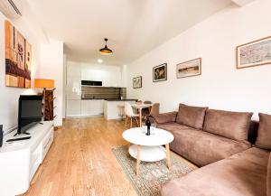 a living room with a couch and a table at Mediterranean Apartment 2 in Budva