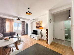 a living room with a couch and a table at Mediterranean Apartment 2 in Budva