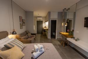 a living room with a couch and a table at Haris Suites in Glyfada Fokidas