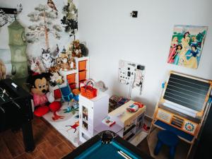 a room filled with toys and a pool table at Willa Pachówka - tam, gdzie natura spotyka się z nowoczesnością in Bukowina Tatrzańska