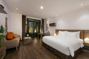Postel nebo postele na pokoji v ubytování The Bloom Pham Viet Chanh - Modern Living Space in Saigon - A Top Choice for Western Travelers