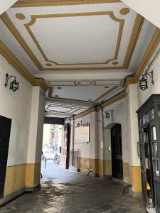 an empty hallway with a coffered ceiling in a building at Re Umberto 311 in Naples