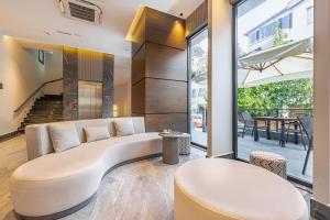 a living room with a couch and a table at Mira Inn Lara in Antalya