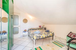 a bedroom with a bed in a room at Villa Maria Luisa vista mare, Palinuro - Happy Rentals in Palinuro +34 photos