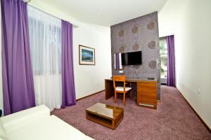 TV in/ali zabaviščno središče v nastanitvi Hotel Gala Split