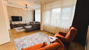 TV a/nebo společenská místnost v ubytování Heaven Down Town Apartment