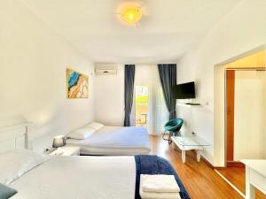 Katil atau katil-katil dalam bilik di FOR-A Apartmani