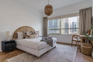 Ένα ή περισσότερα κρεβάτια σε δωμάτιο στο GuestReady - Bohemian Apt with Marina View