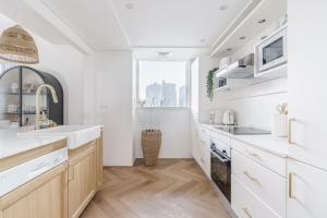 Η κουζίνα ή μικρή κουζίνα στο GuestReady - Bohemian Apt with Marina View