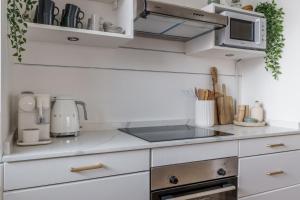 Η κουζίνα ή μικρή κουζίνα στο GuestReady - Bohemian Apt with Marina View