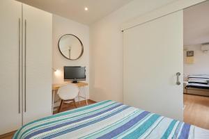 GuestReady - Acogedor Apt en La Barcelonetaにあるベッド
