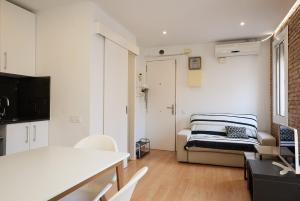 GuestReady - Acogedor Apt en La Barcelonetaにあるベッド