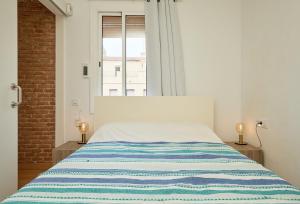 GuestReady - Acogedor Apt en La Barcelonetaにあるベッド