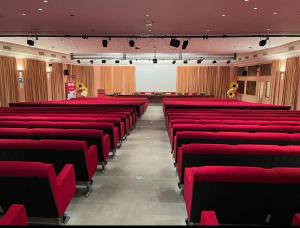 an empty auditorium with red seats in a room at Grand Hotel De Londres in Sanremo +88 photos