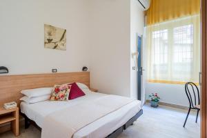 Postel nebo postele na pokoji v ubytování Hotel Sayonara