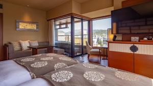 a bedroom with a bed and a living room at Sora Niwa Terrace Kyoto Bettei in Kyoto