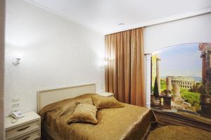 Cama o camas de una habitación en Hotel Zolotoy Globus