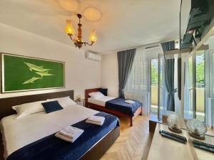 Katil atau katil-katil dalam bilik di FOR-A Apartmani