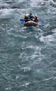 a group of people in a raft in the water at Peaceful apartment in Pluzine