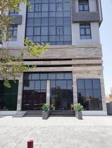 a building with large windows in front of it at panorama residence in Kuwait