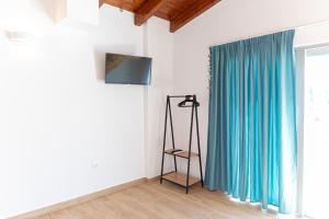 TV a/nebo společenská místnost v ubytování De Sol
