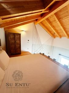 Postel nebo postele na pokoji v ubytování Su Entu Sardinian Country Club