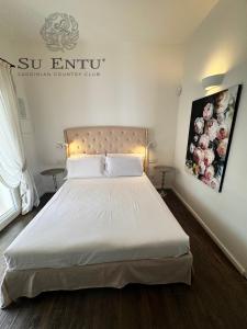 Postel nebo postele na pokoji v ubytování Su Entu Sardinian Country Club