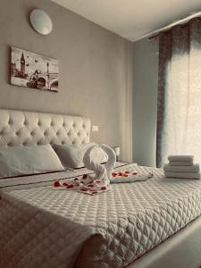 Postel nebo postele na pokoji v ubytování B&B Le Grazie