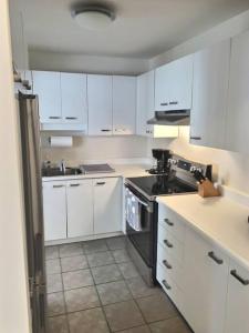 Η κουζίνα ή μικρή κουζίνα στο Amazing condo in the Old Port