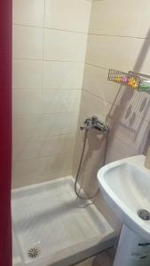 a bathroom with a shower and a sink at Bright Sea - Studios in Limenas