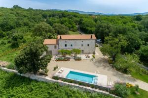 an aerial view of a house with a swimming pool at Villa Batalini in Šumber