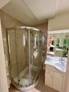 a bathroom with a shower and a sink at Burlington Townhouse in Dublin