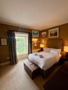 a bedroom with a large bed and a window at Burlington Townhouse in Dublin