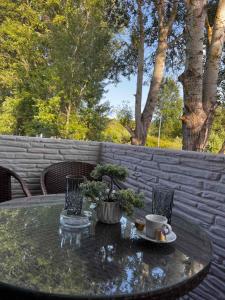 a table with a cup of coffee on top of it at House Karga in Ormos Panagias