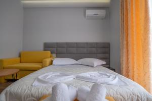 Postel nebo postele na pokoji v ubytování Sunkised Hotel