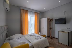 Postel nebo postele na pokoji v ubytování Sunkised Hotel